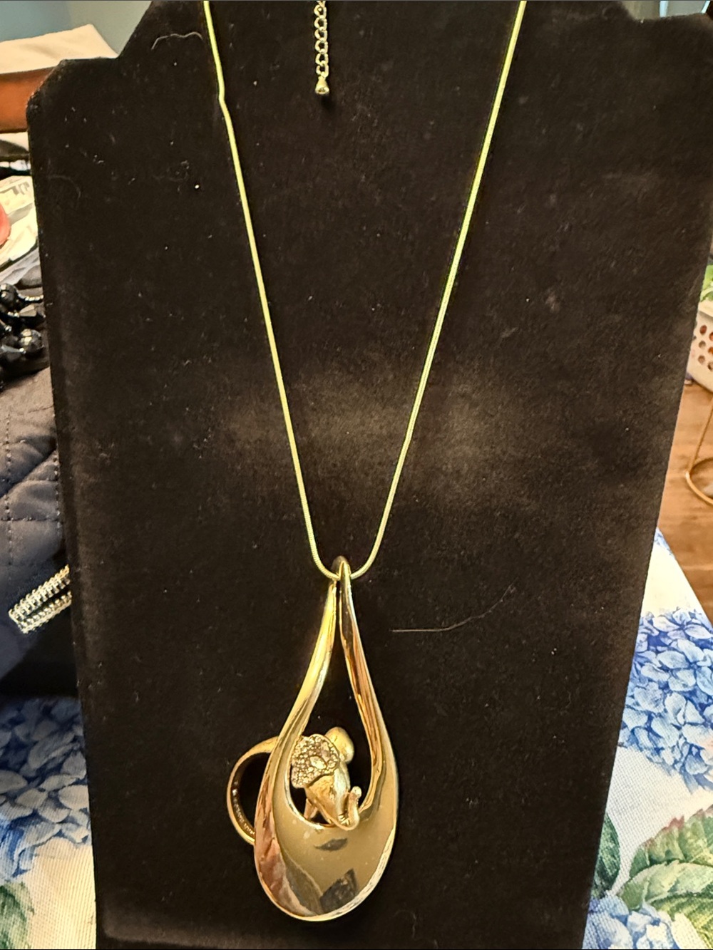 Gold Teardrop Pendant Necklace with Flower Accent with gold elephant ring